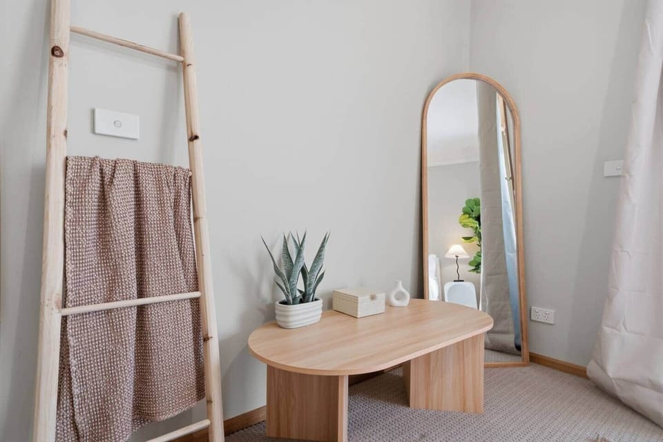 Comfortable master bedroom with natural light and stylish decor