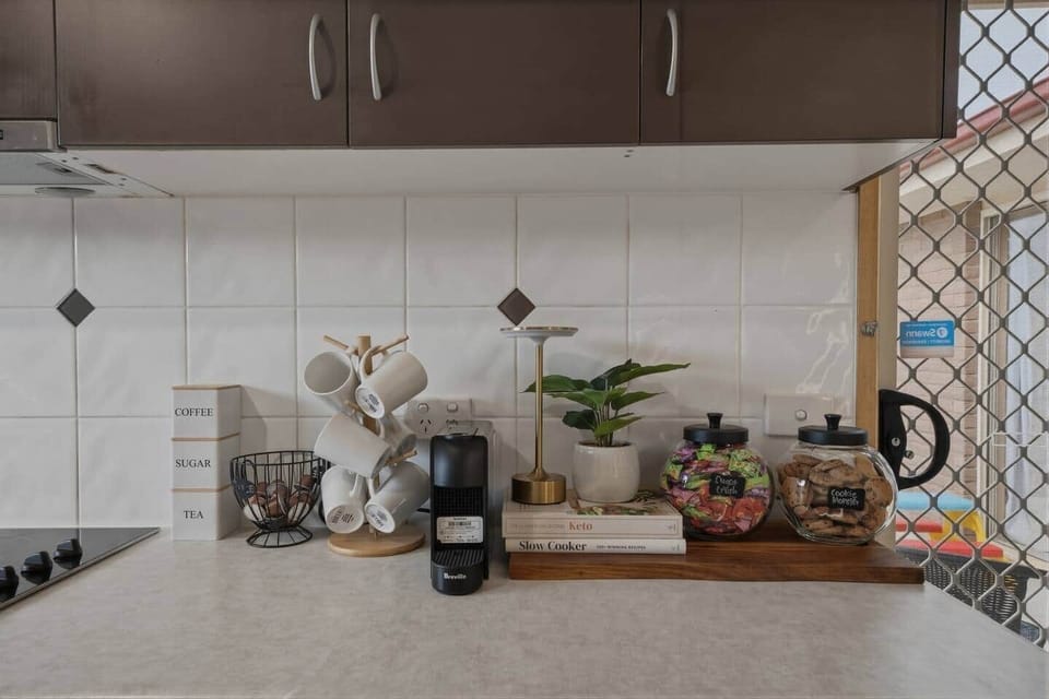 Clean and functional kitchen with quality appliances and storage
