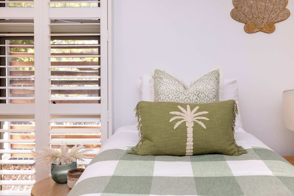 Relax in this bright bedroom with two single beds