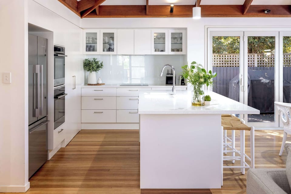 The modern kitchen is fully equipped for easy family meals and holiday entertaining.
