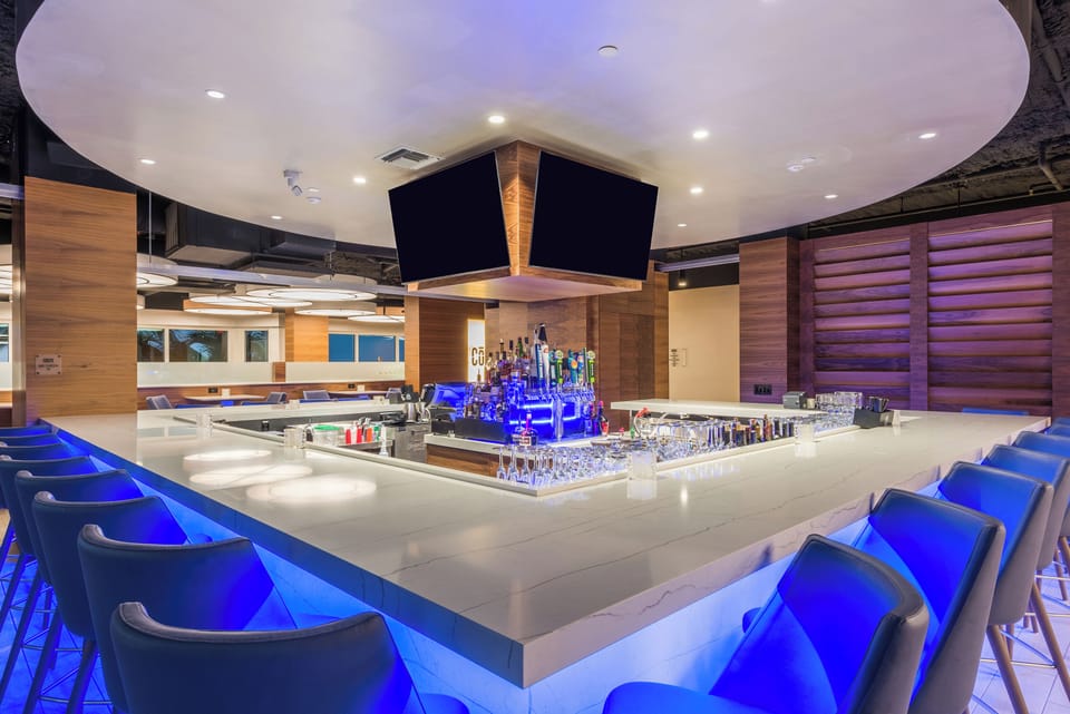 Enjoy intimate window tables with the beach as backdrop.