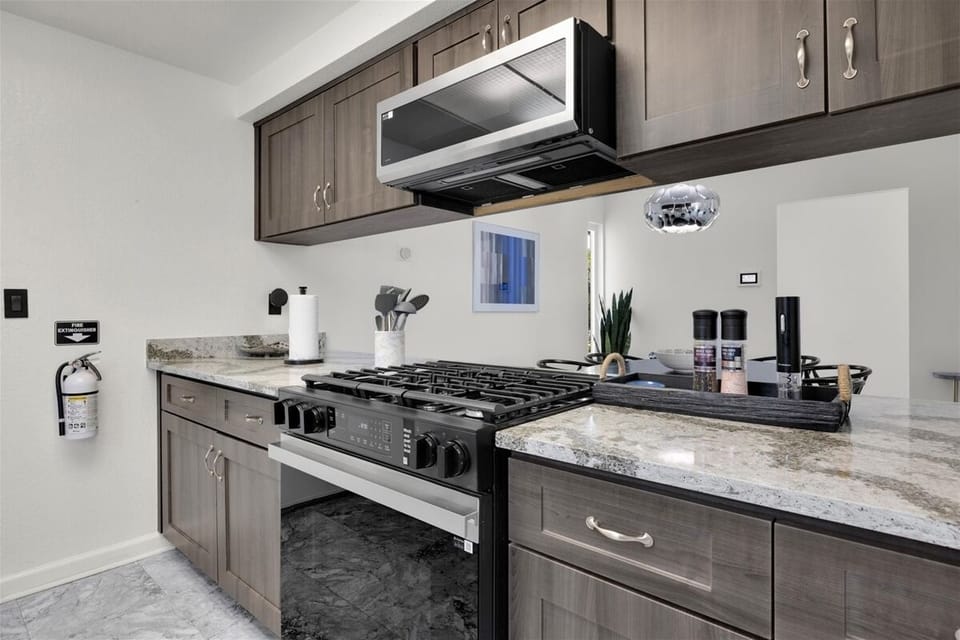 Fully equipped kitchen with gas range and modern finishes