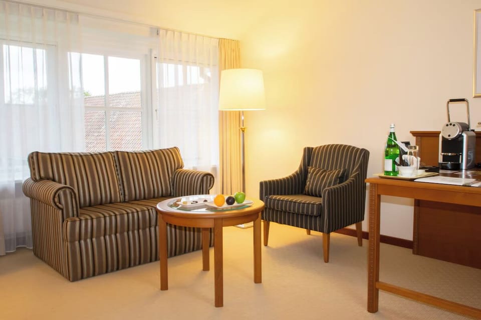 Sip a morning espresso beside the window in soft armchairs
