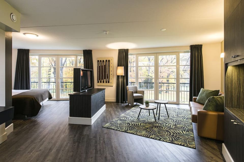 Stretch out in an airy suite with lounge seating.