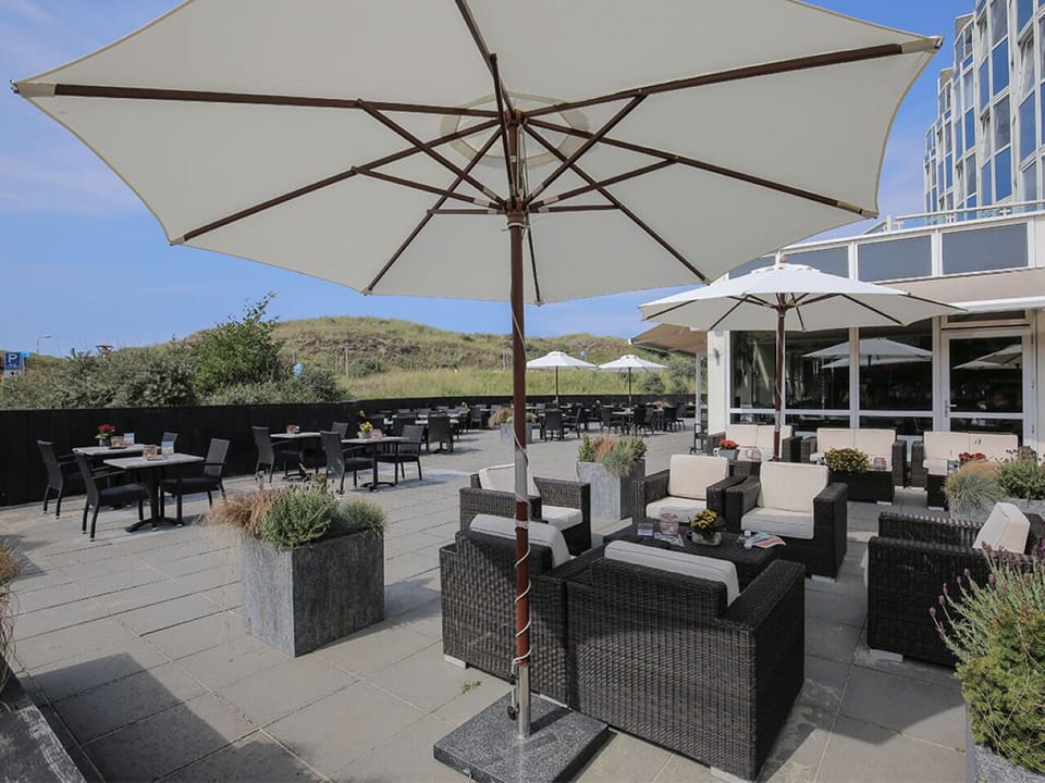 Soak up sunshine on the spacious terrace with comfy seating.