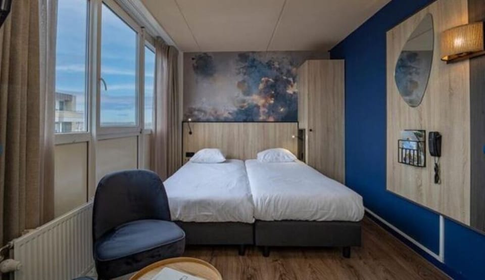 Wake up to soft daylight beside crisp, comfortable twin beds.
