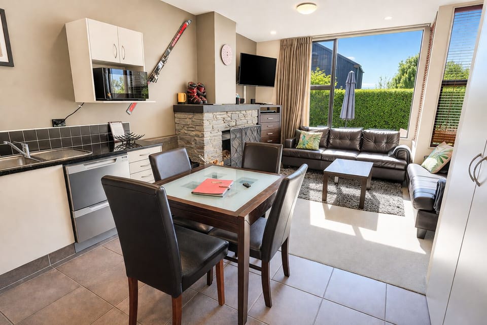 open living room and kitchen with a nice cozy fire place