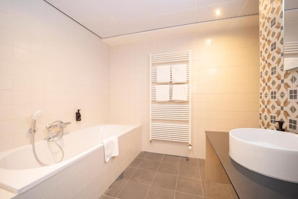 Soak away the day in a deep, clean bathtub.
