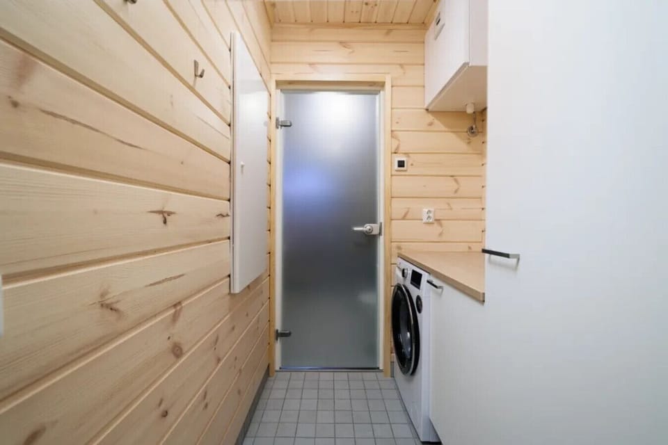 The convenient laundry area with a washing machine allows you to easily refresh your outdoor gear and keep your clothes clean throughout your stay.