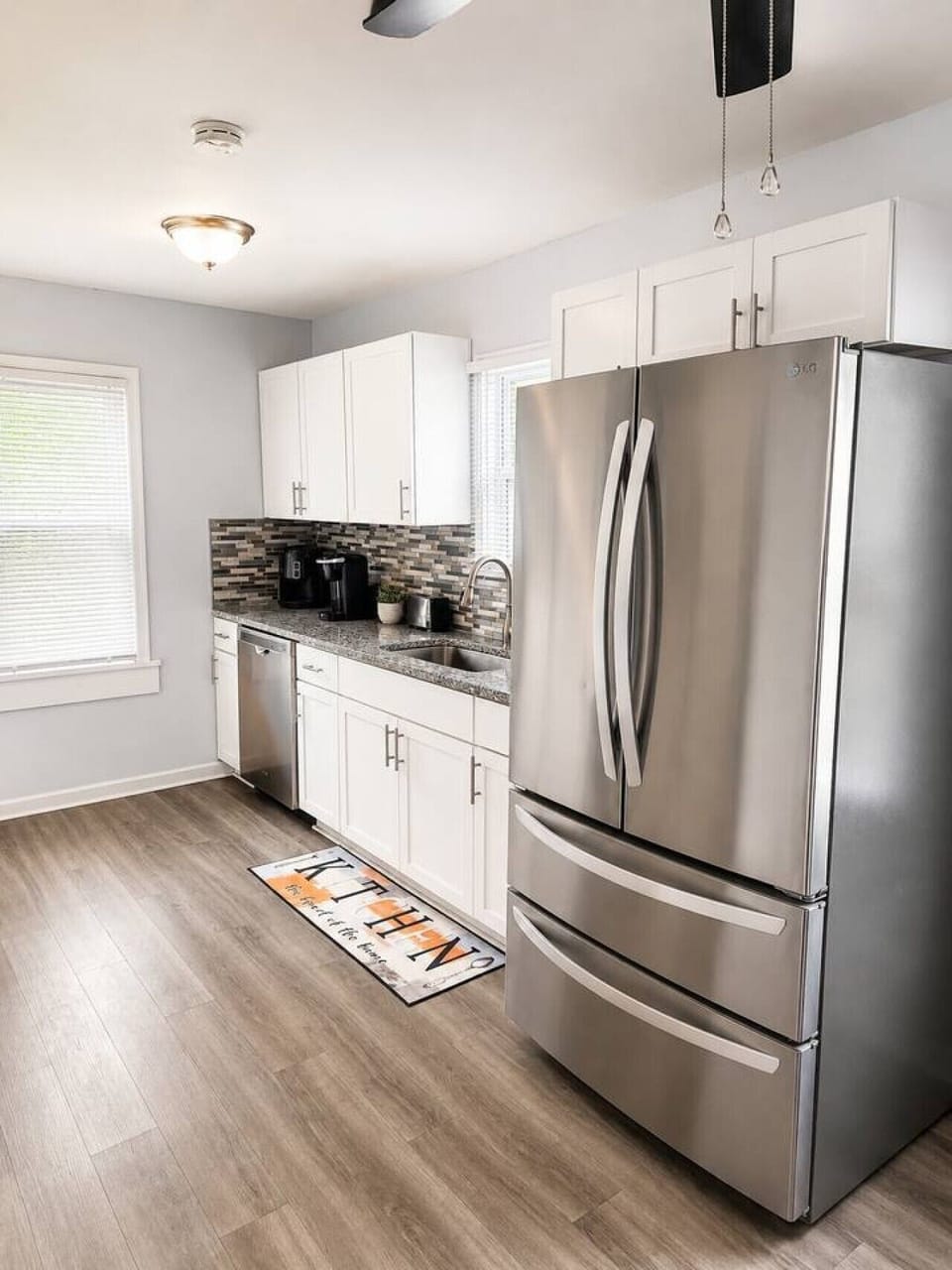 Fully equipped kitchen with updated finishes and stainless steel appliances