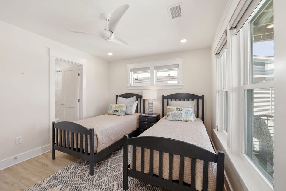 Main Level: Bedroom w/ 2 Single Beds, and Attached Full Bathroom