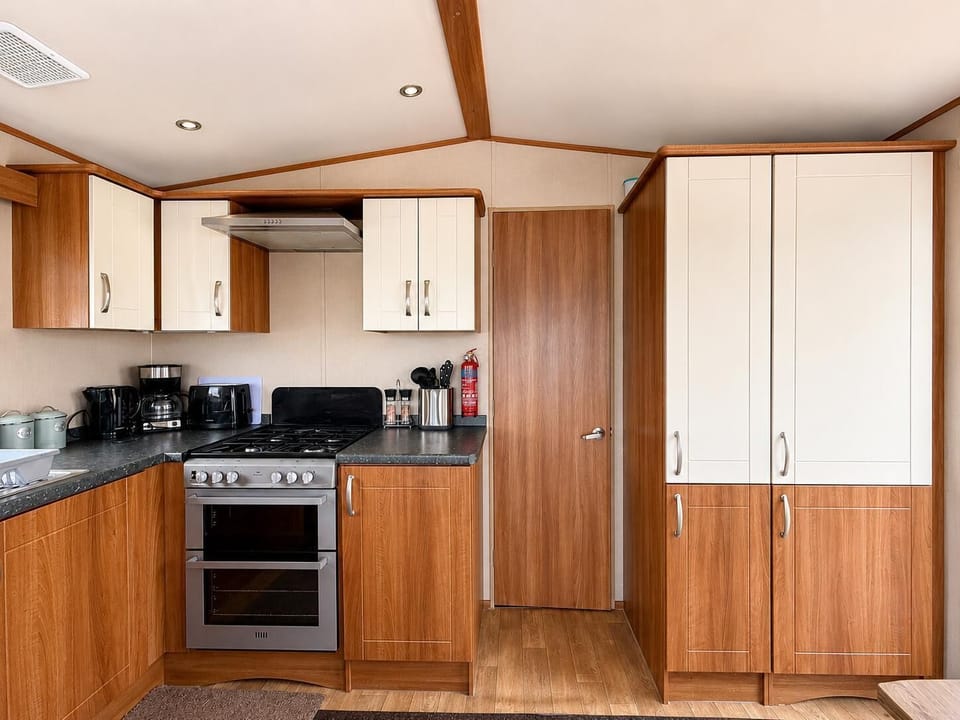 The caravan kitchen is ideal for preparing quick snacks or full meals during your trip.