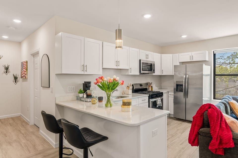 A clean, fully equipped kitchen with space to cook, prep, or just gather over coffee before the day starts.