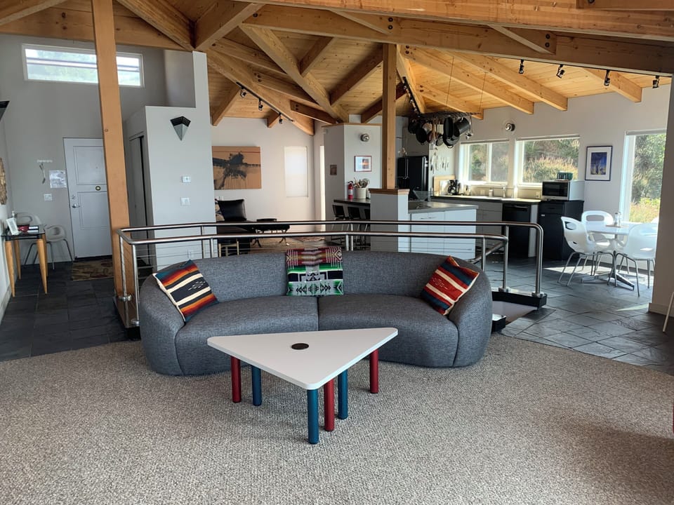 Open plan main room, looking towards kitchen
