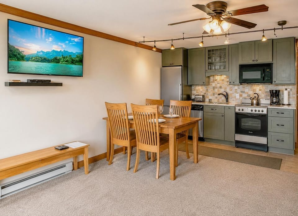 The updated kitchen offers a stylish and inviting space to prepare meals, snacks, and drinks during your stay.