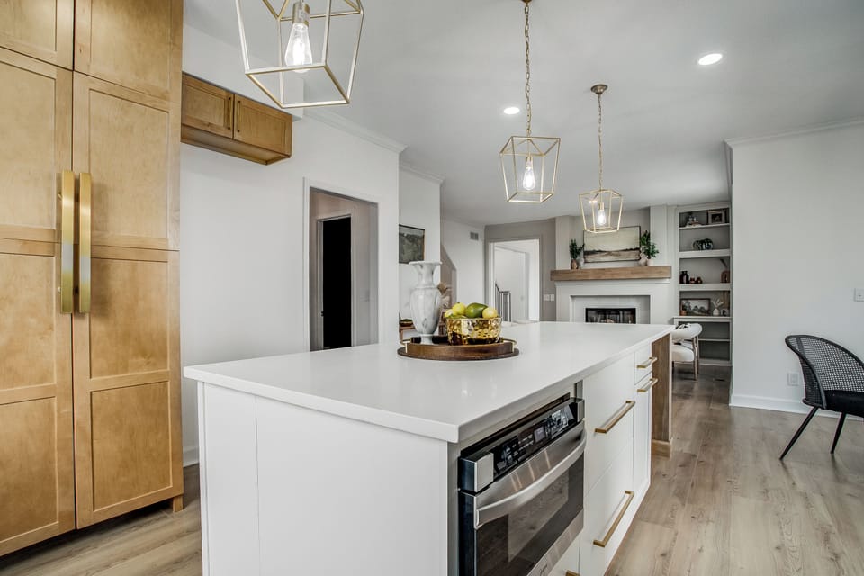 Elegant kitchen island with open warm gathering space.