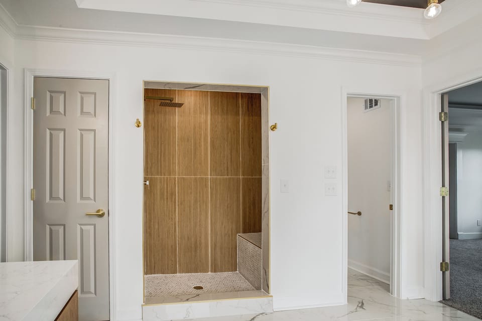 Modern walk in shower with spa like luxury finishes.