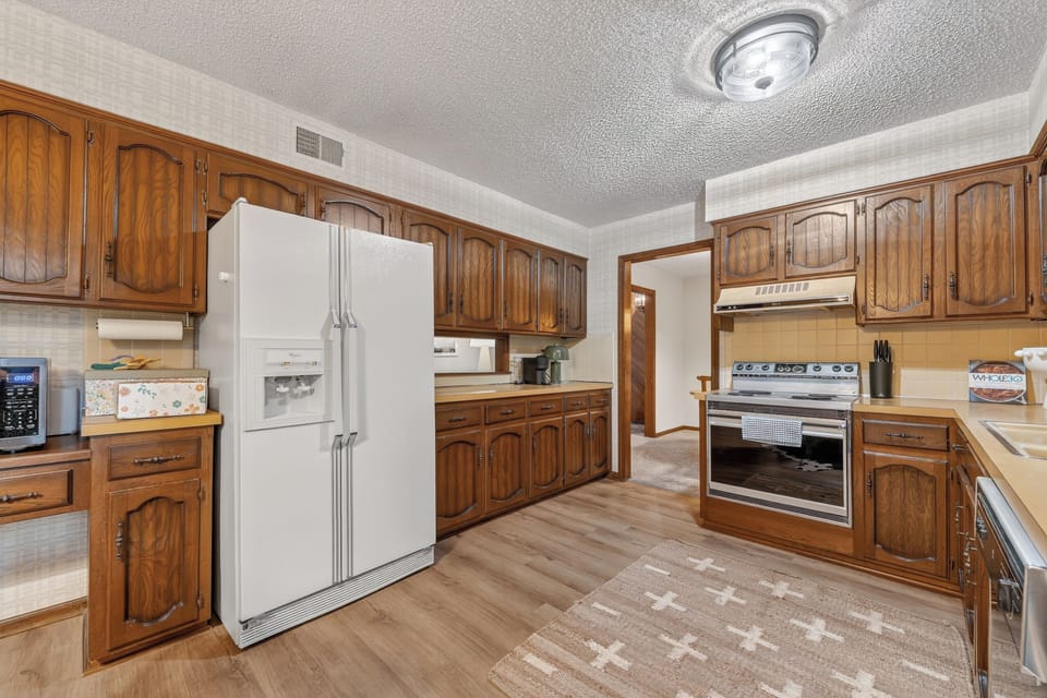 Bright and airy kitchen with classic cabinetry and plenty of natural light.