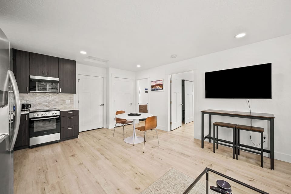 Step into your sleek, open space where modern design meets comfort. The stylish kitchen invites you to cook up something delicious, while the cozy dining nook is perfect for morning coffee or evening meals.
