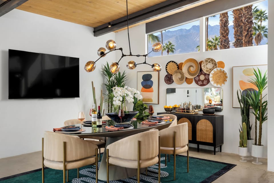 Gather around this stunning dining table where dramatic lighting and mountain views create the perfect backdrop for your memorable meals together.