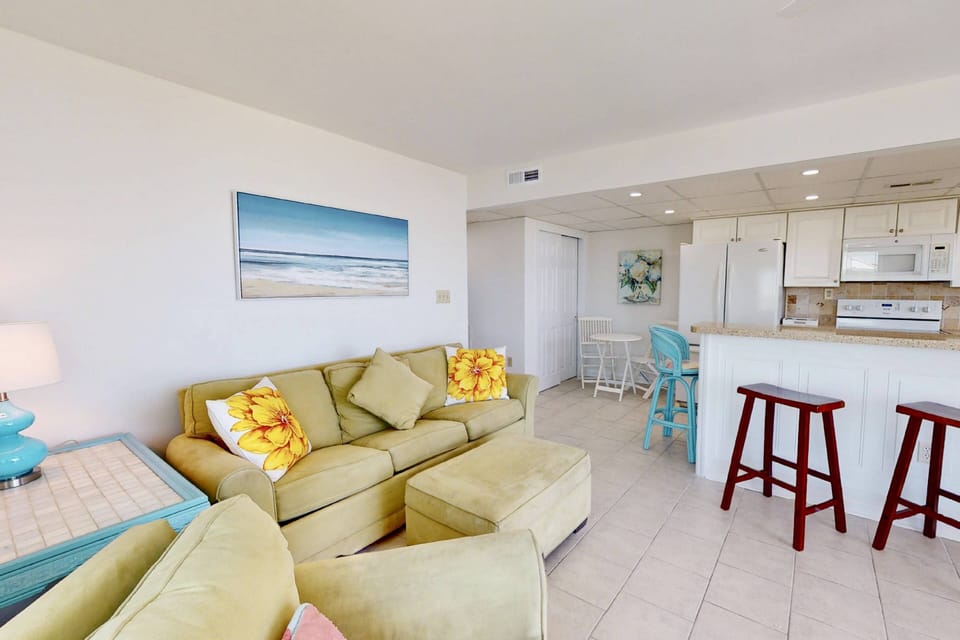 The living room features a pullout queen size sofa bed