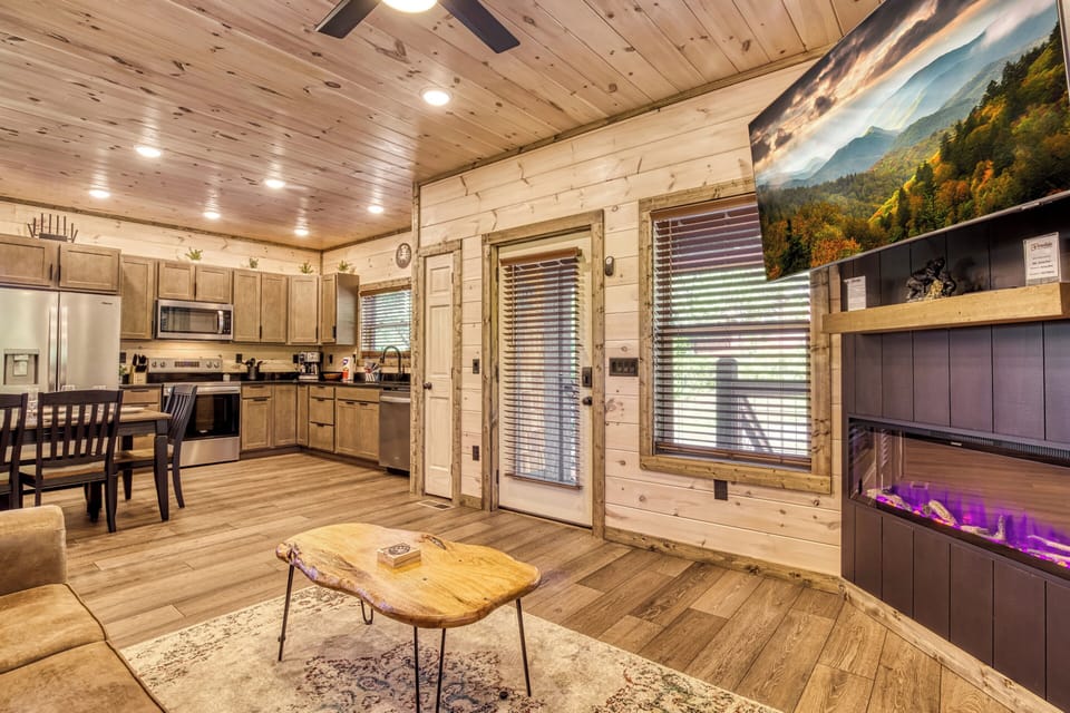 Cabin with a View in the Smokies "Honey Bear" - Living room, dining room, and fully furnished kitchen