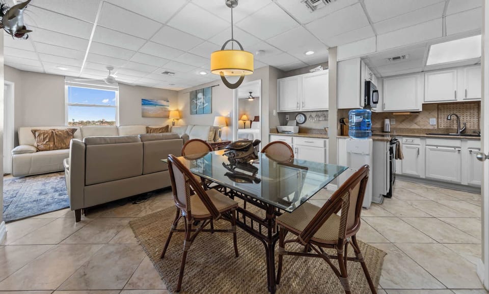 Gather in the open living, dining, and kitchen space