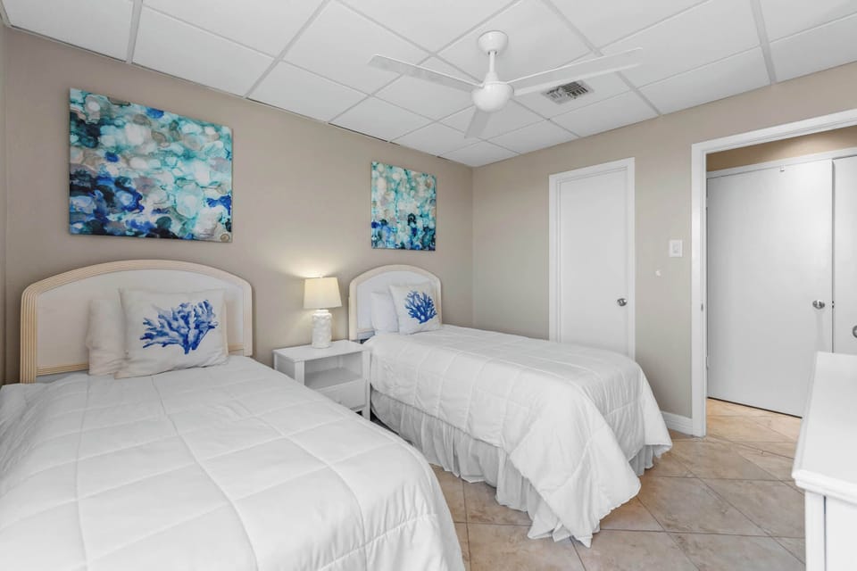 A bright, coastal second bedroom for kids or friends