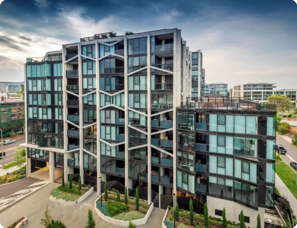 Metropol's striking design features bold, angular facades inspired by Canberra's iconic landmarks like the National Gallery and High Court of Australia. 