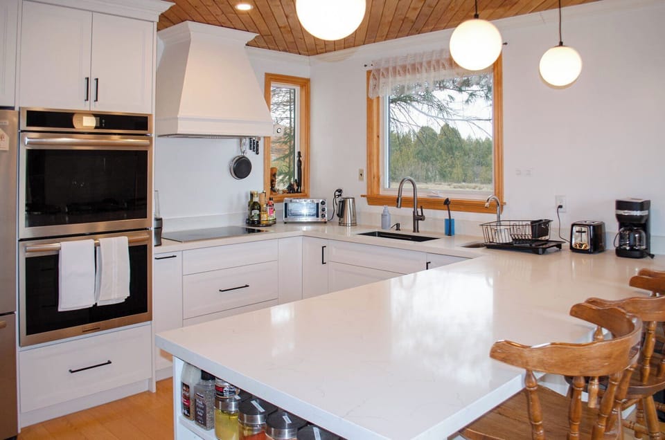 Natural morning light with view of the cow pasture from the sink