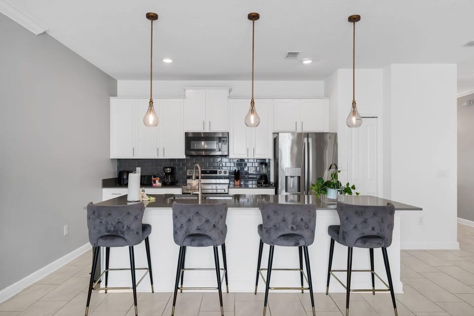 Modern fully equipped kitchen with everything needed for cooking and dining at home.