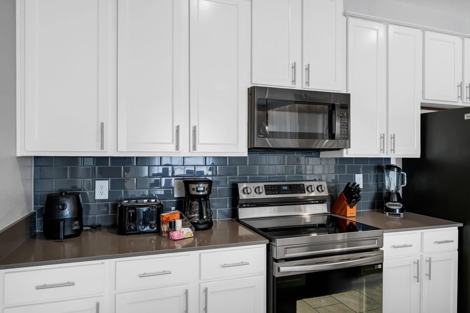 Modern fully equipped kitchen with everything needed for cooking and dining at home.