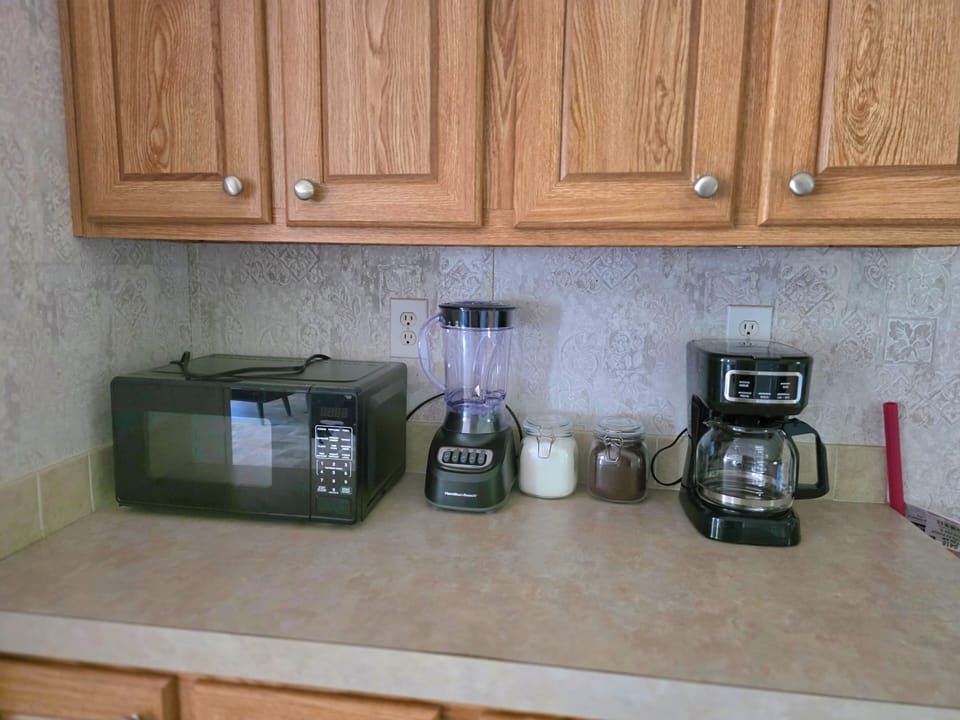 Coffee maker, blender and microwave for your convience.