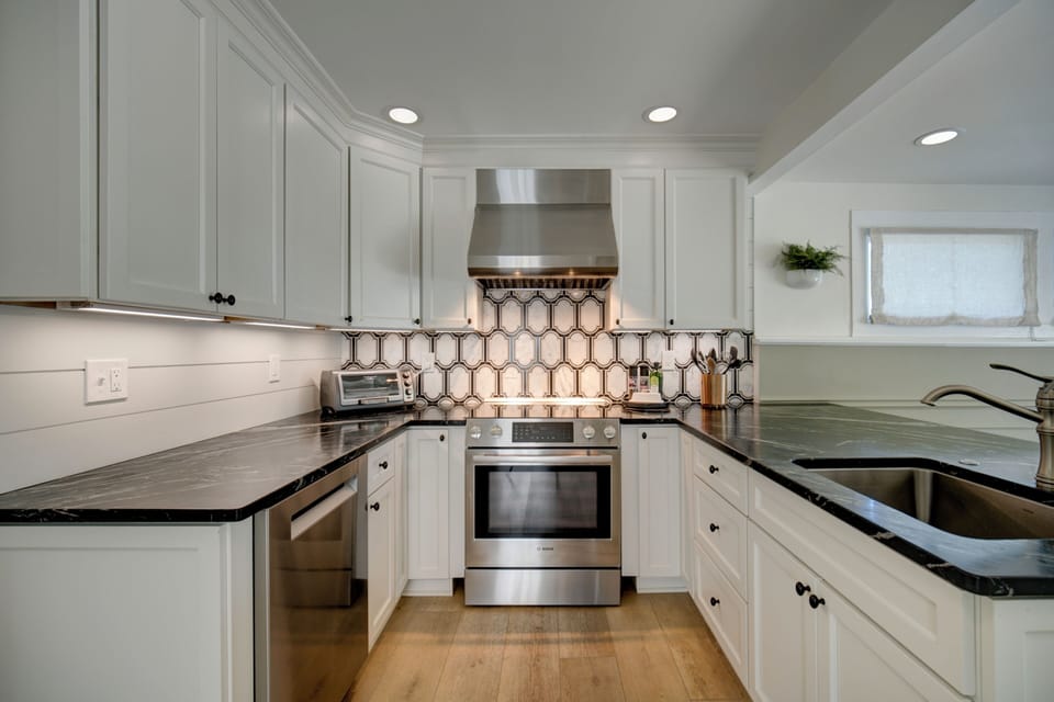 Recently added marble mosaic backsplash. Toaster oven on left