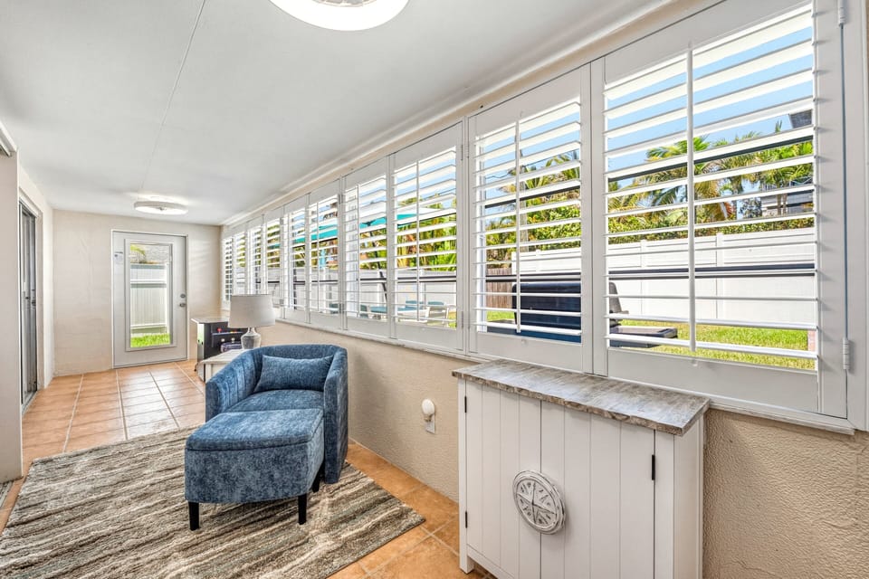 Cozy sunroom retreat with natural light and a quiet place to relax.