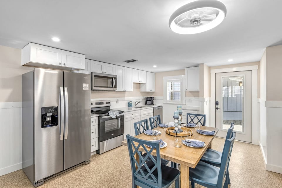 Dining and kitchen areas designed to feel connected.