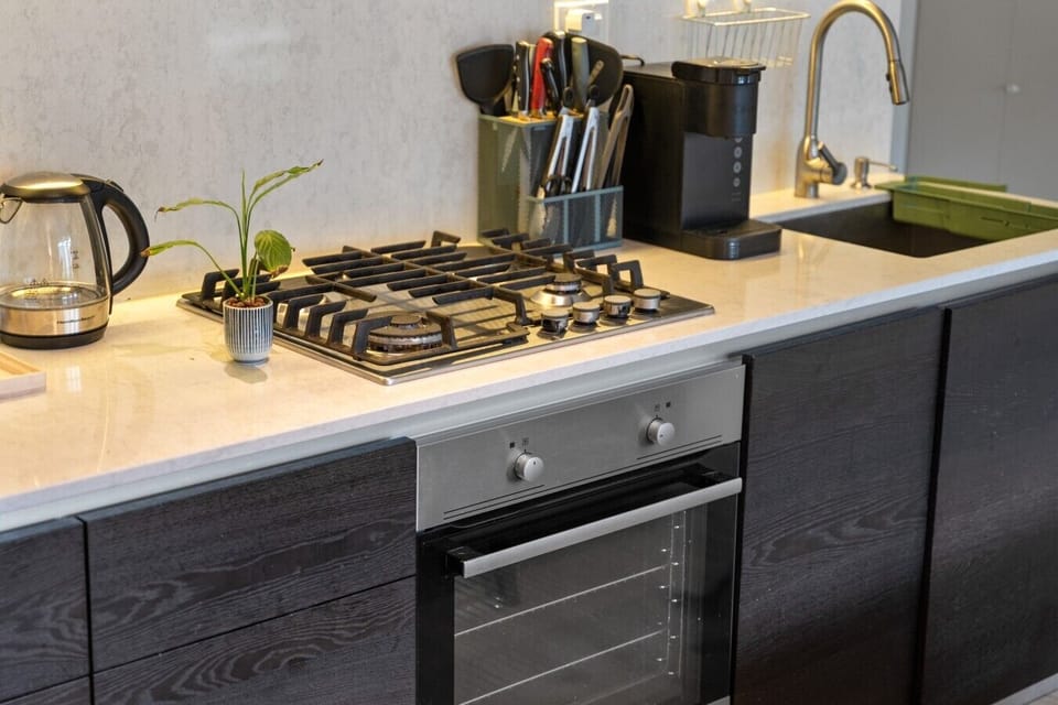 Kitchen: Modern appliances and sleek design await your culinary adventures!
