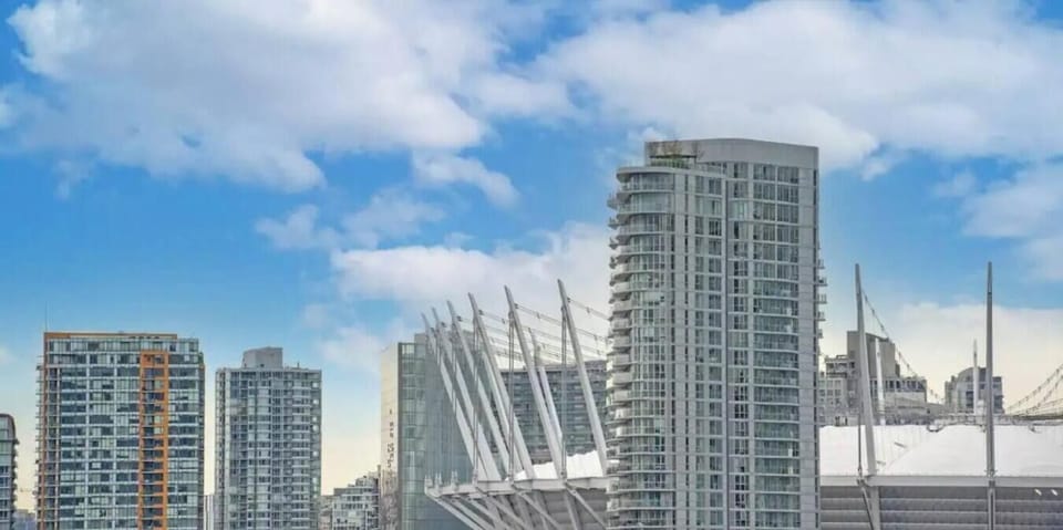 City View: Experience urban excitement with stunning sights of Rogers Arena and BC Place!