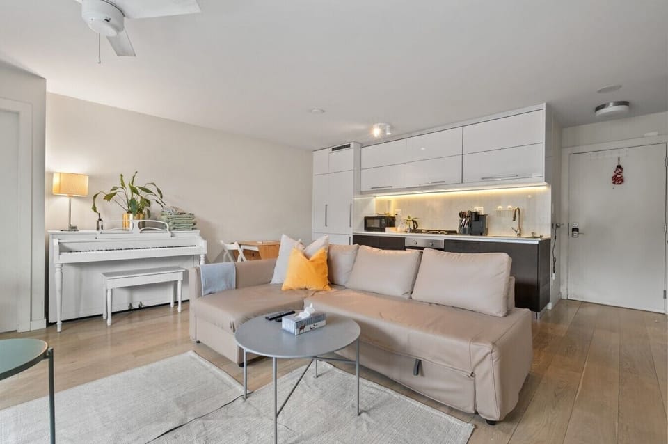 Living Room: Bright and airy space with modern decor and a piano for your musical moments!