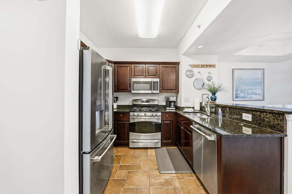 The kitchen stays within reach for quick snacks, coffee refills, and easy family meals.