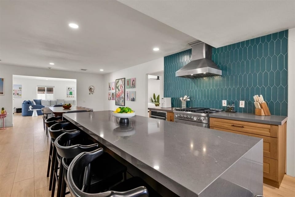 Entertainer's kitchen with oversized island and gas range