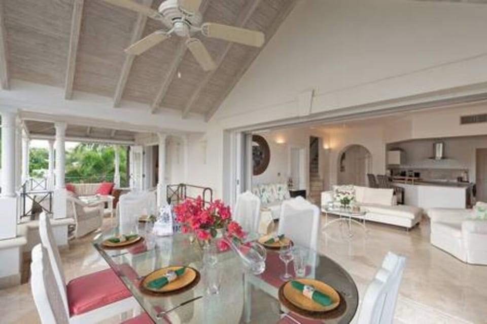 Beautiful dining area positioned on the the verandah with views out to sea and over the communal pool area.