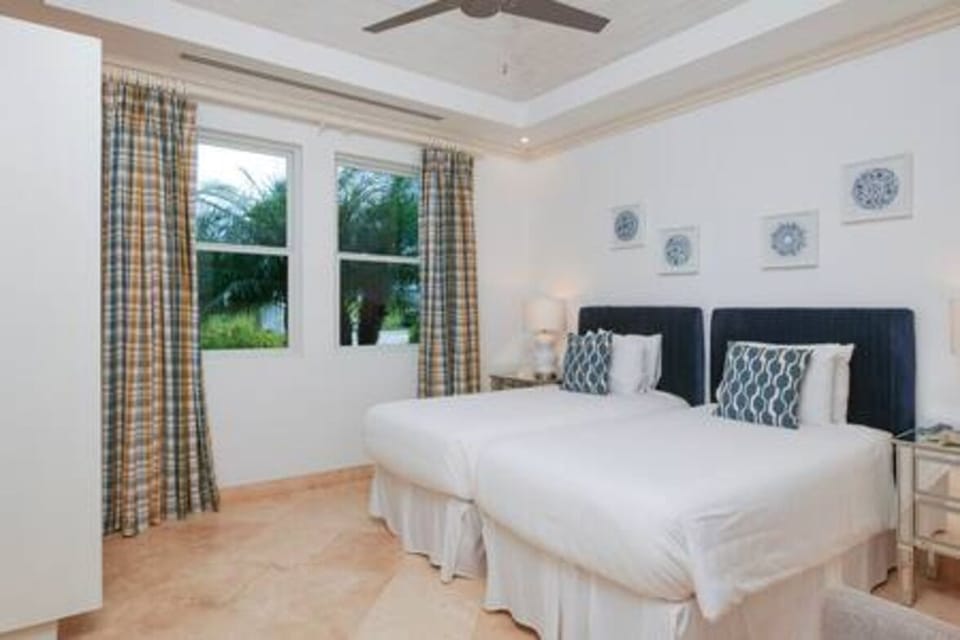 Bedroom four with twin bed (can be made into a king size) en suite, air conditioning, ceiling fan, smart TV, wardrobe.