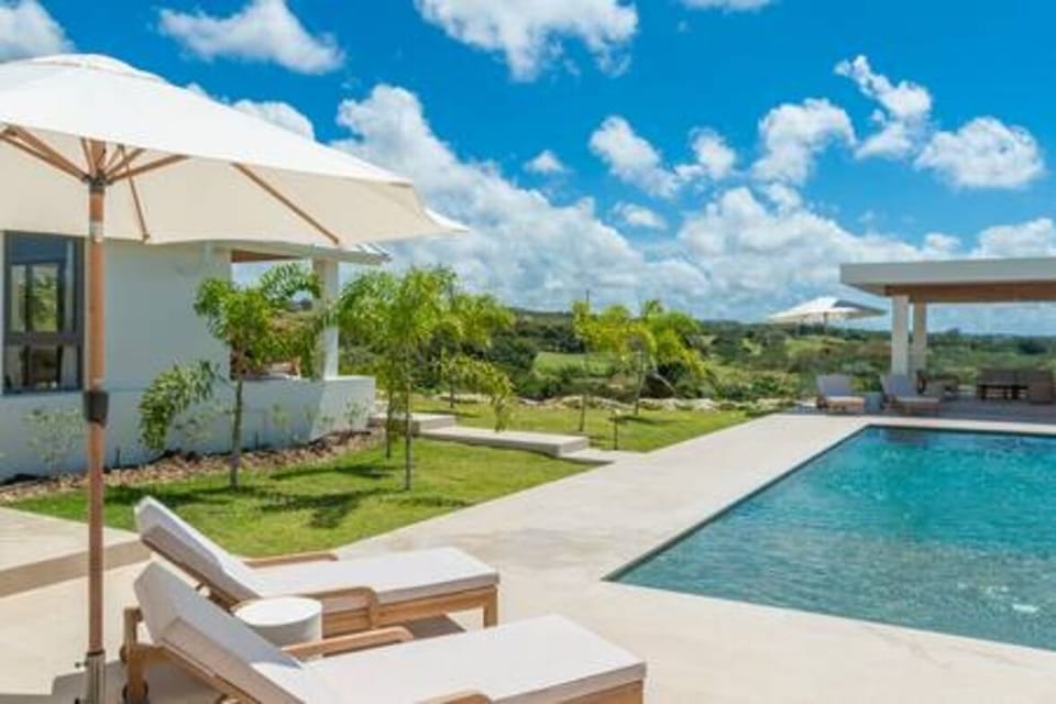 Sitting perched on the ridge with enviable views is Cloud Break Villa with private pool, modern gazebo and refreshingly modern and spacious interiors.