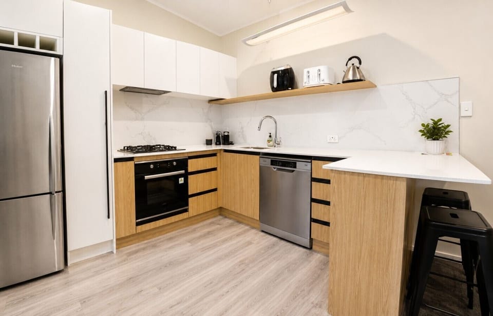 Well-equipped modern kitchen with quality appliances and plenty of prep space