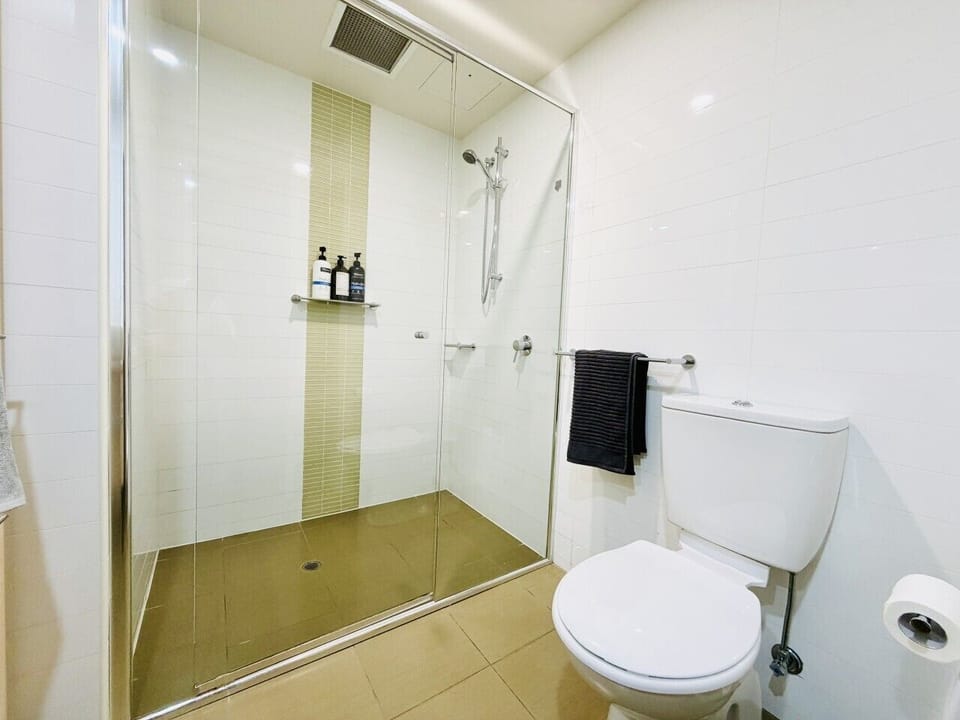 Clean, modern bathroom with towels, shampoo and essentials included.
