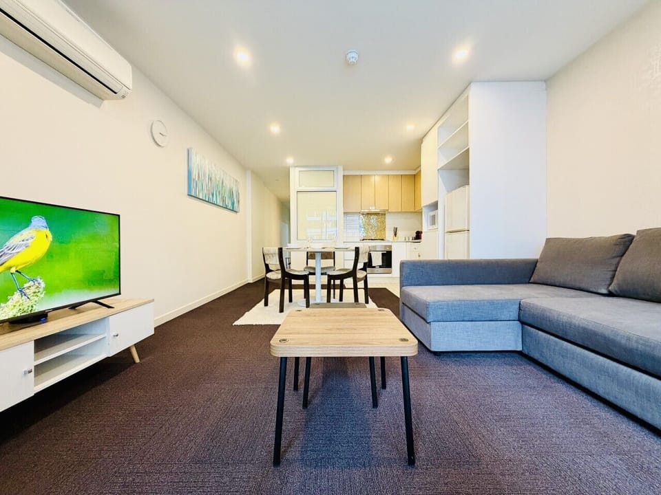 Comfortable living area with Smart TV and sofa bed for added sleeping flexibility.