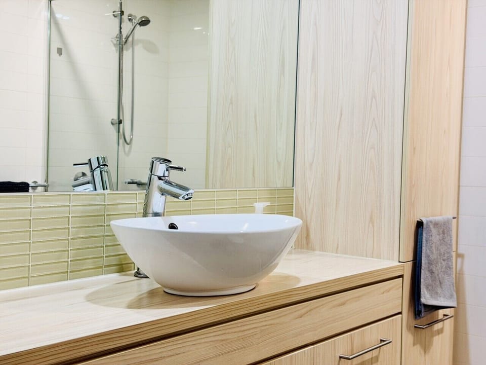 Clean, modern bathroom with towels, shampoo and essentials included.