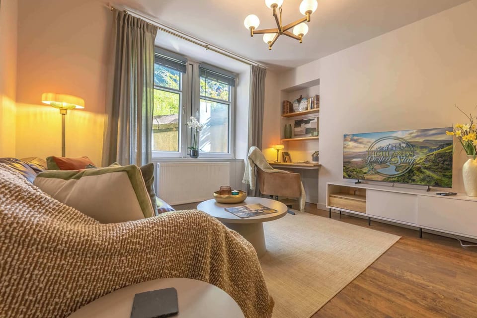 ✨ Unwind in this cozy, light-filled living space—perfect for relaxing after a day of exploring.