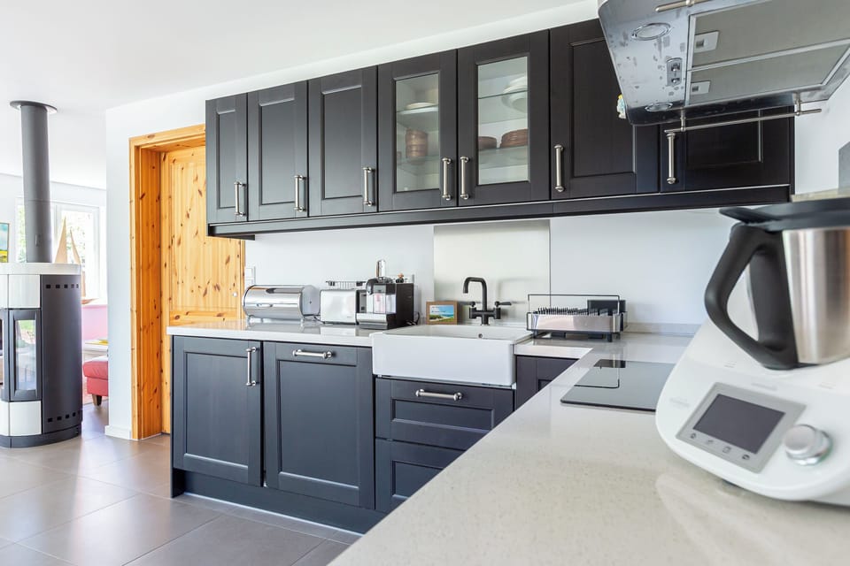 Modern Kitchen with Black Cabinets and Appliances
